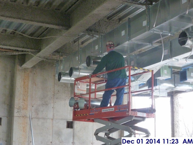 Installing ductwork fitters at the 2nd floor Facing East